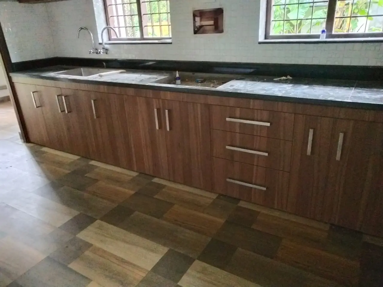 Completed kitchen with walnut-finish cabinets
