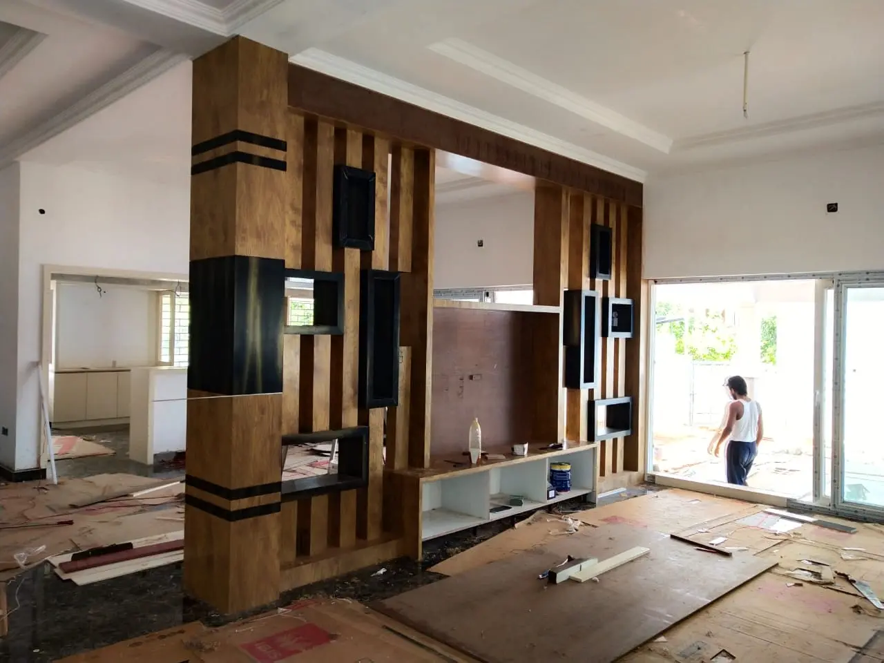 Custom living-area partition being installed